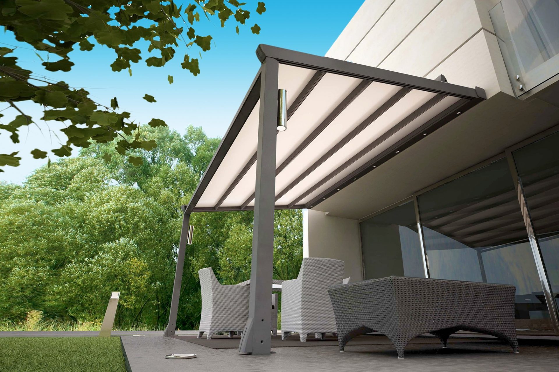 Retractable white roof over beautifu balcony lounge set up in Melbourne by Undercover Blinds and Awnings in Melbourne